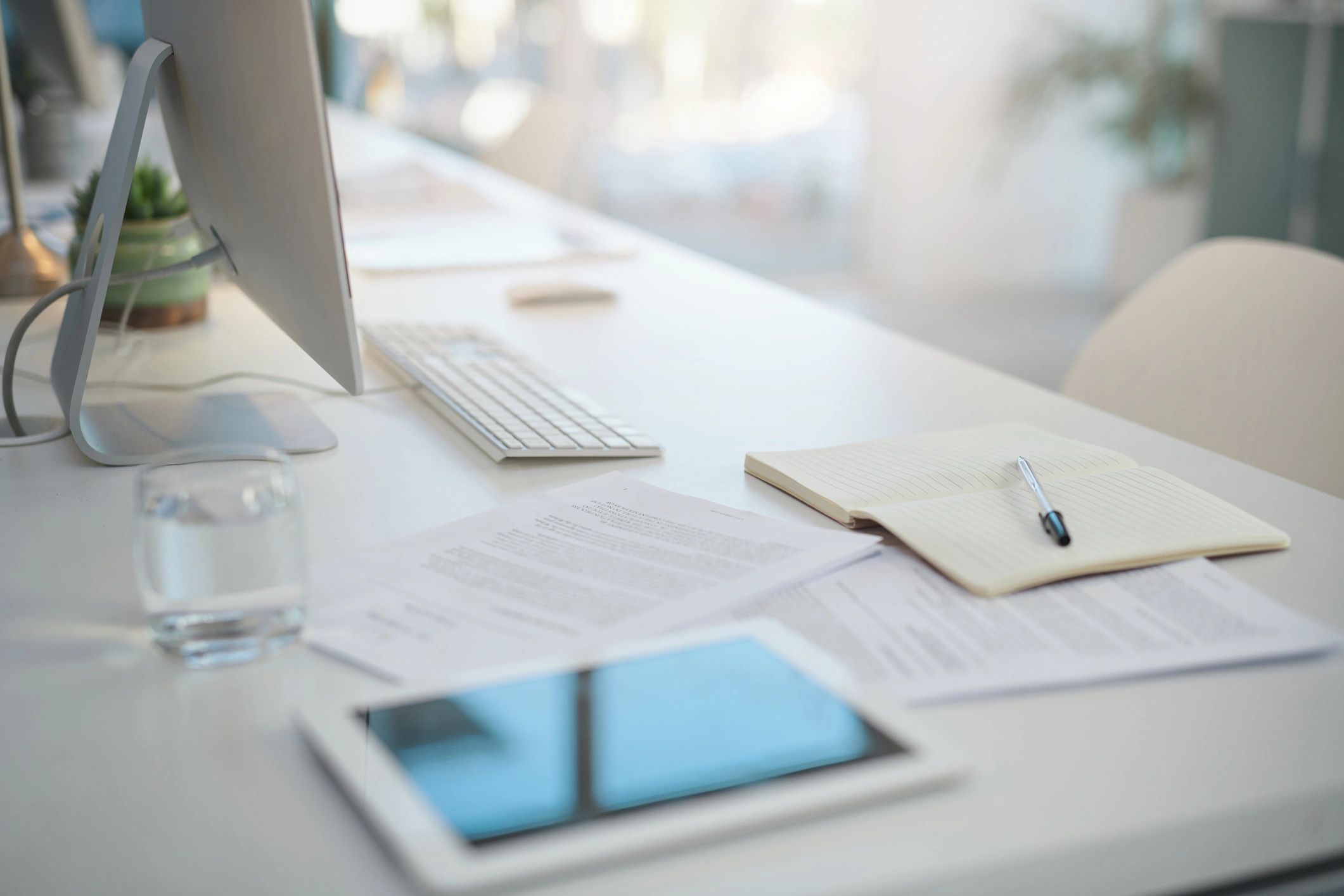 Notebook and work items on a desk representing planning and reflection