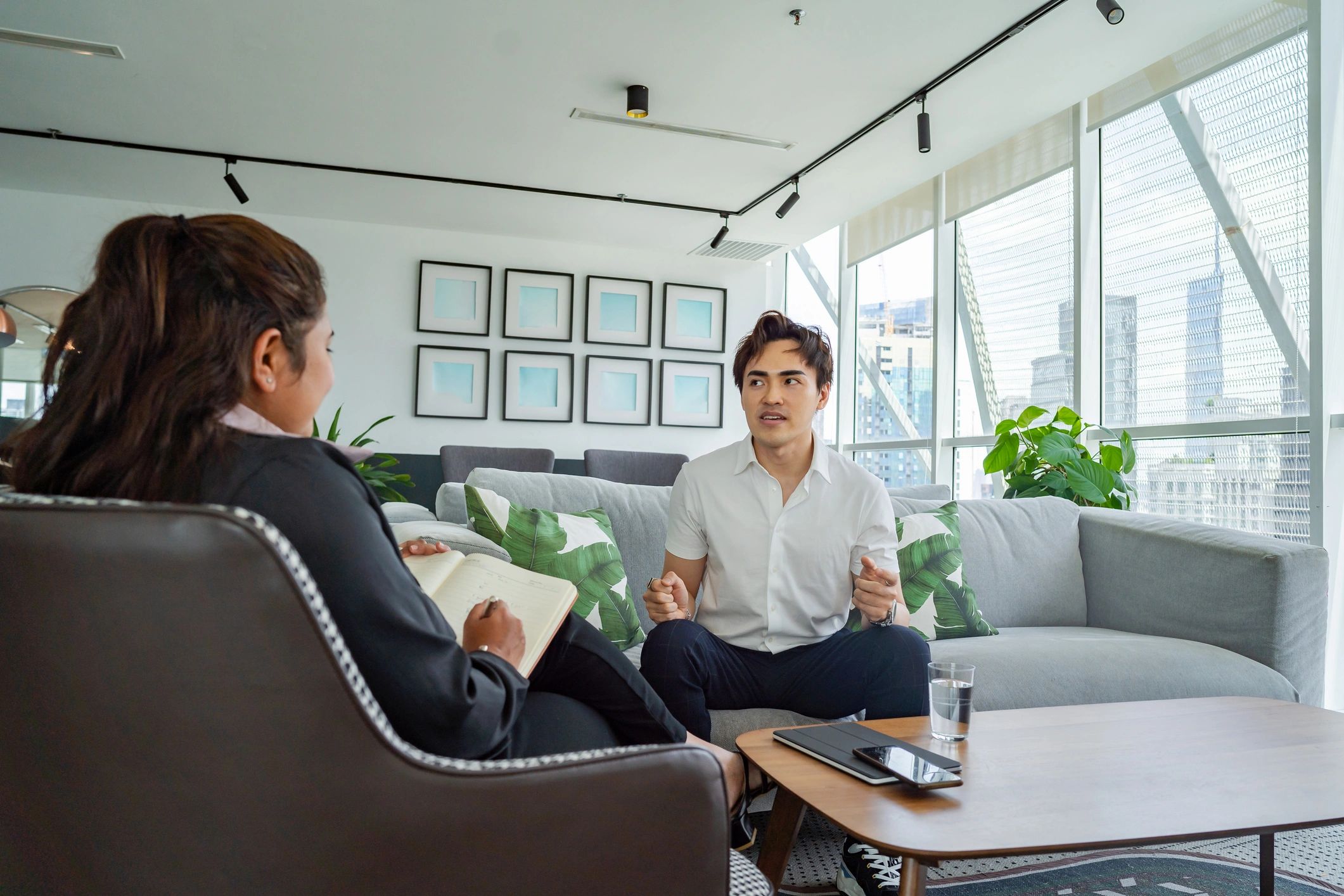 One-on-one coaching conversation in a professional setting